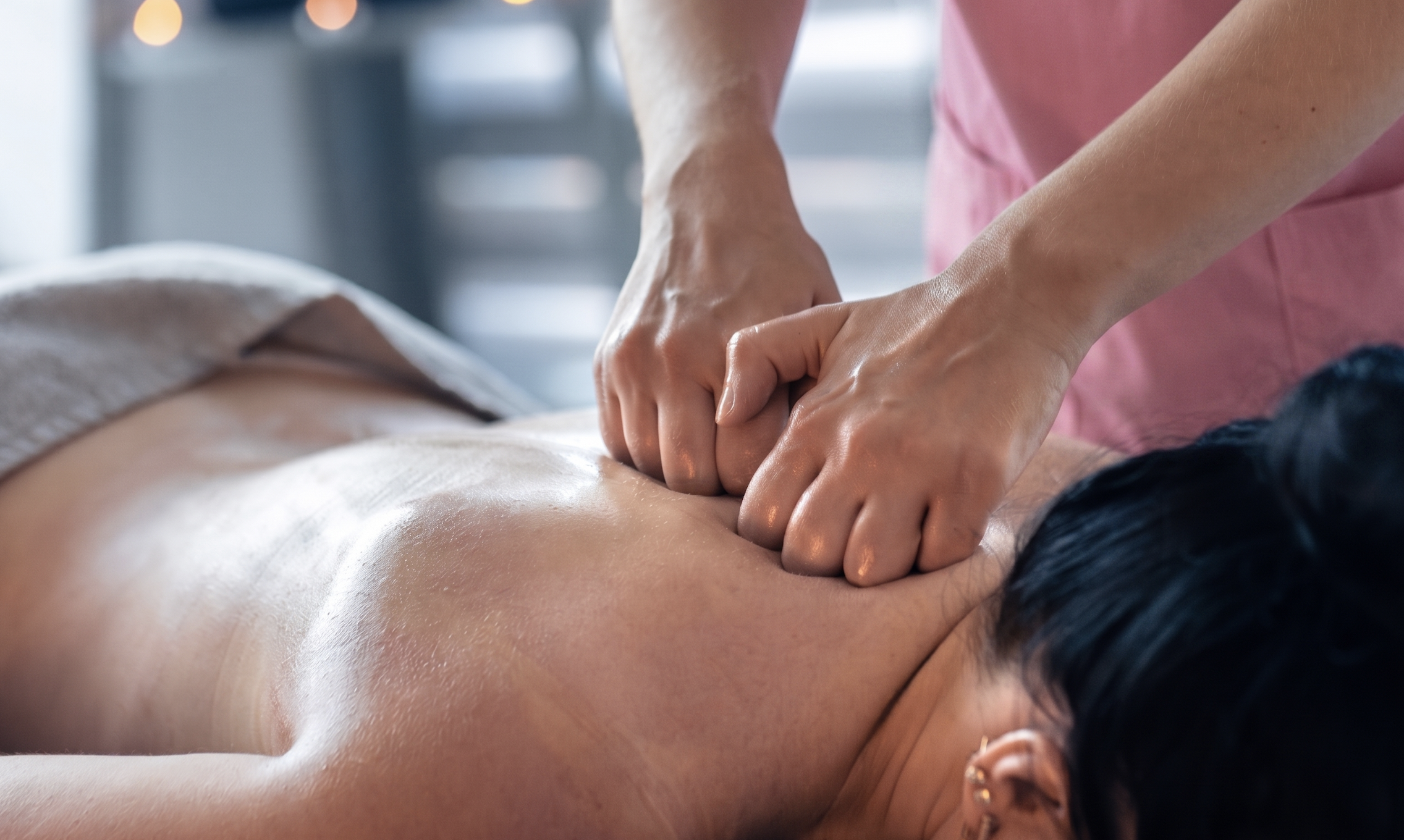 Deep tissue massage being performed on a client